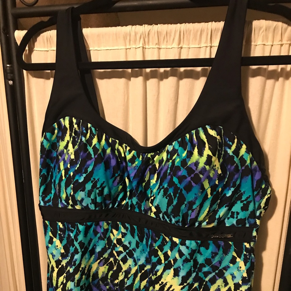 Tankini, swim shorts and cover up.